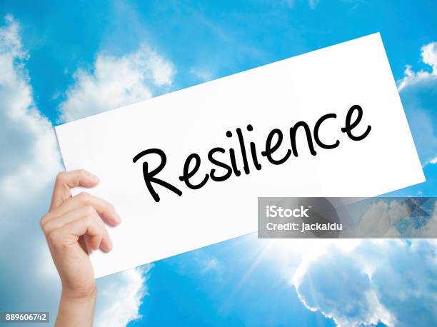 Resilience Sign On White Paper Man Hand Holding Paper With Text Isolated On Sky Background Stock Photo - Download Image Now