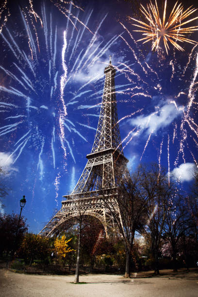 istock celebrating New Year in the city - Eiffel tower (Paris, France) with fireworks 889606780
