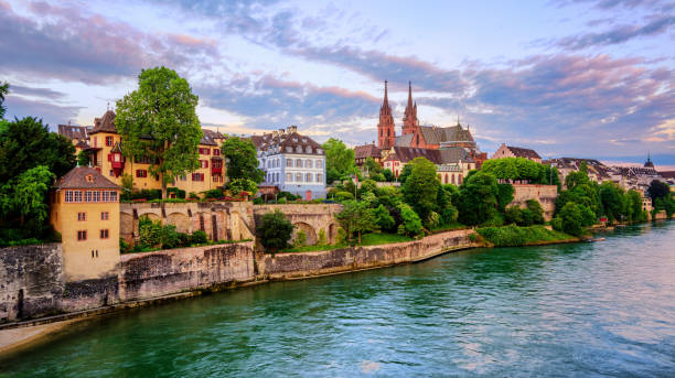 Basel Old Town with Munster cathedral and Rhine, Switzerland Panoramic view of the Old Town of Basel with red stone Munster cathedral and the Rhine river, Switzerland basel switzerland photos stock pictures, royalty-free photos & images