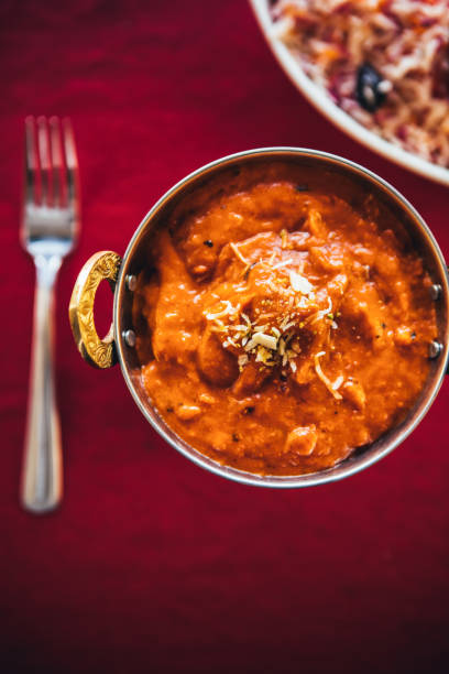 Butter chicken curry inside Karahi Indian Serving Dishes. North Indian food