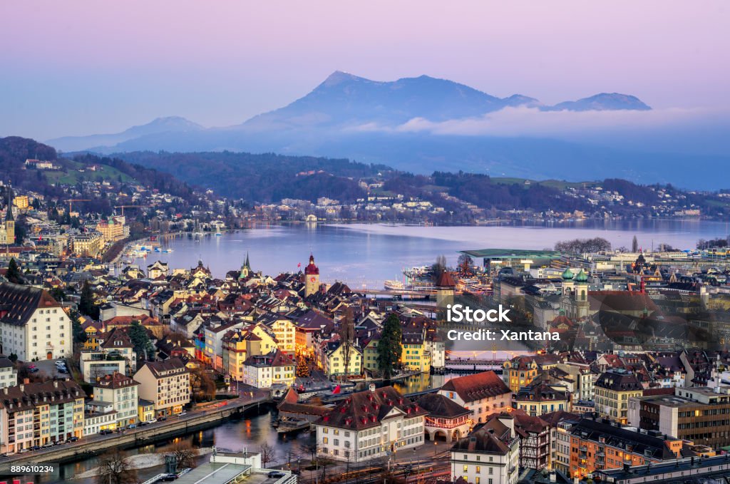 Lucerne town, Lake Lucerne and Rigi Mountain, Switzerland Aerial view of the Old Town of Lucerne, wooden Chapel bridge, stone Water tower, Reuss river, Rigi mountain and Lake Lucerne, Switzerland, on sunset Switzerland Stock Photo