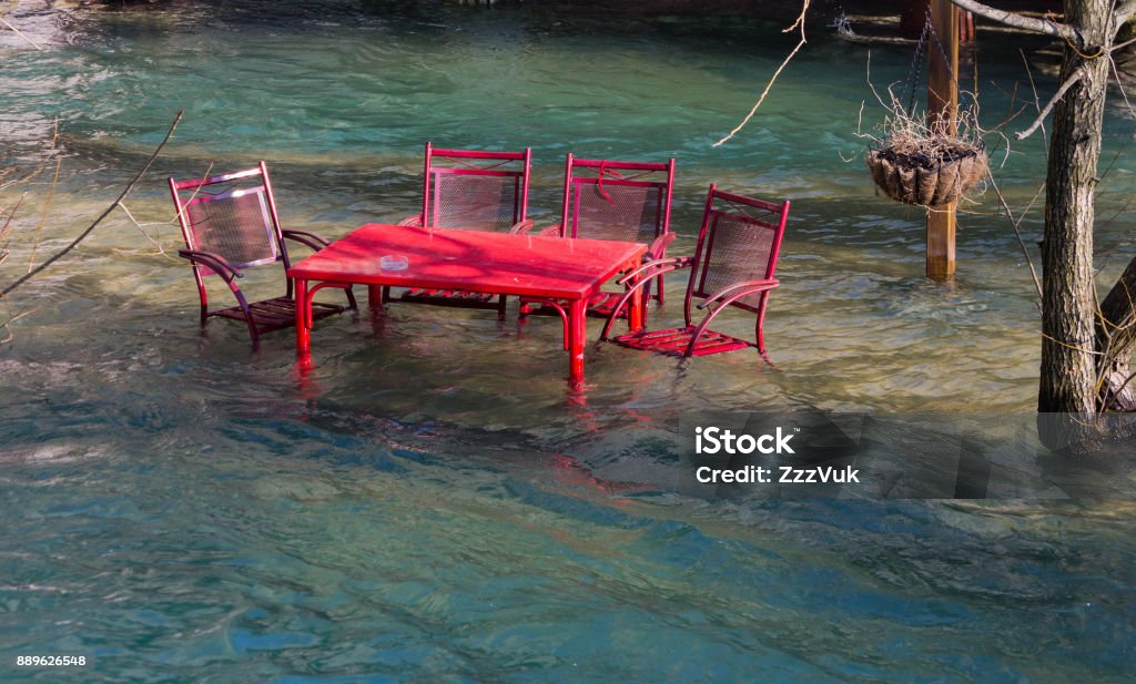 Flood Flood scene with table and chairs in water. Bosnia and Herzegovina Stock Photo