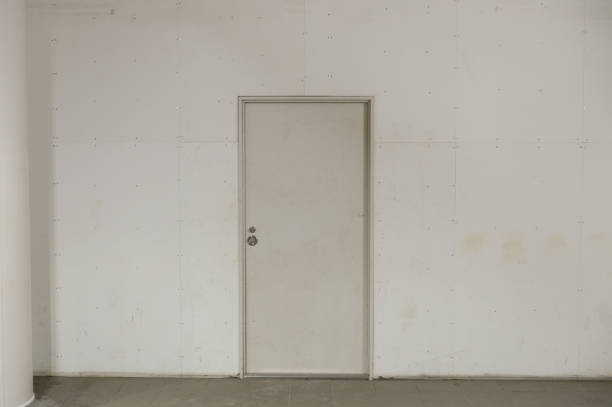 istock sidewalk by street wall & door 889627284