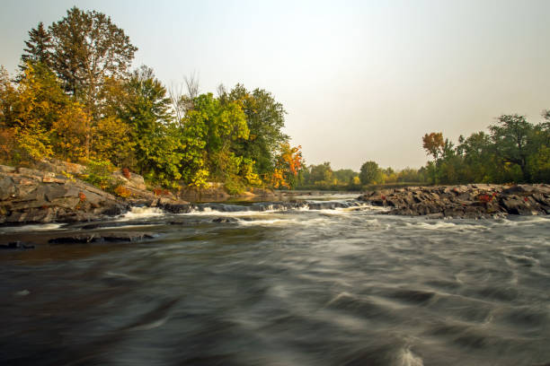 istock water falls leading to faster flowing river 889627416