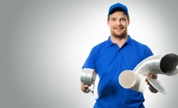 istock hvac worker with ventilation system equipment in hands on gray background 889629872
