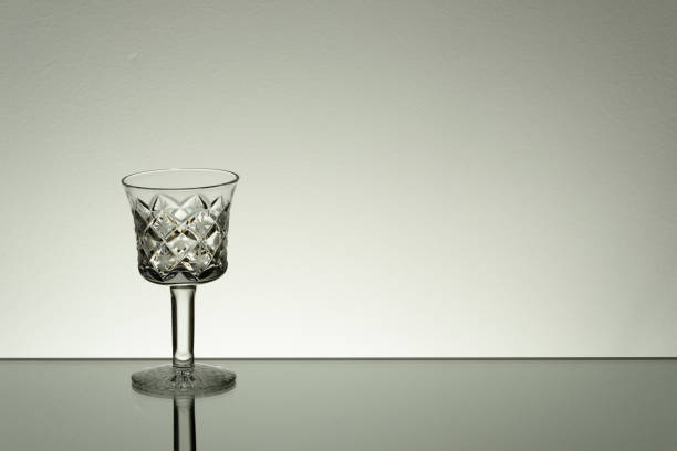 istock Glass on mirror and black background illuminated 889630776