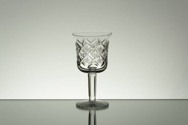 istock Glass on mirror and black background illuminated 889630796
