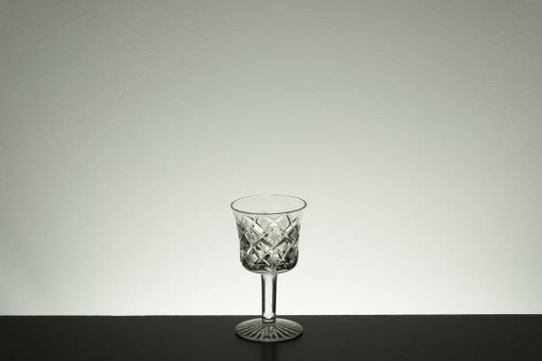 istock Glass on mirror and black background illuminated 889632886