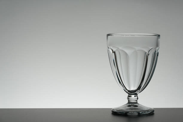 istock Glass on mirror and black background illuminated 889637312
