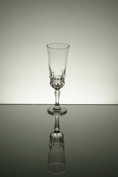 istock Glass on mirror and black background illuminated 889637830