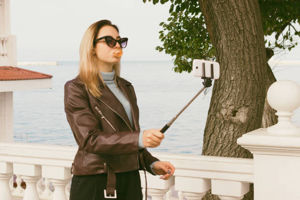 istock Young pretty girl, selfie, outdoor 889638708