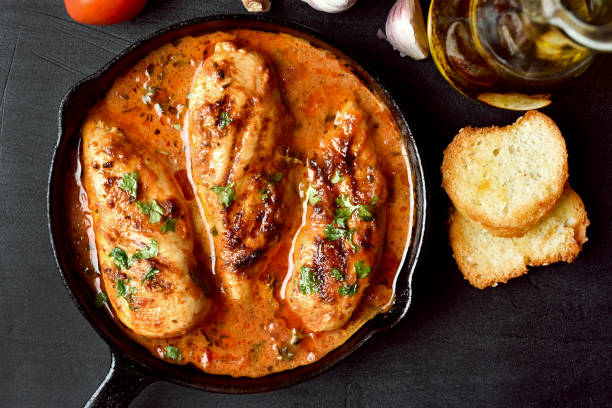 istock Chicken breast in tomato sauce 889654922