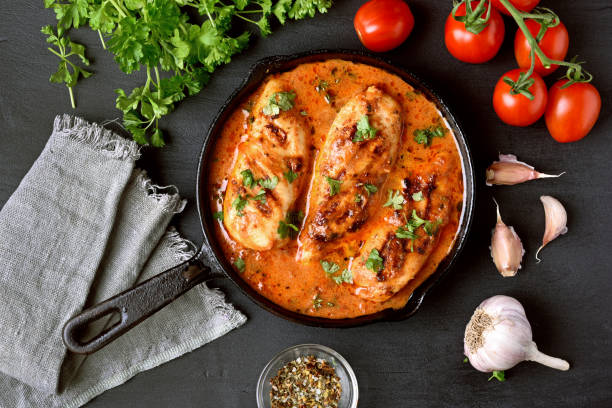 istock Chicken breast in tomato sauce 889654944