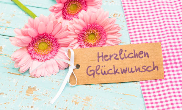 istock Beautiful pink flowers with congratulation greeting card 889654946