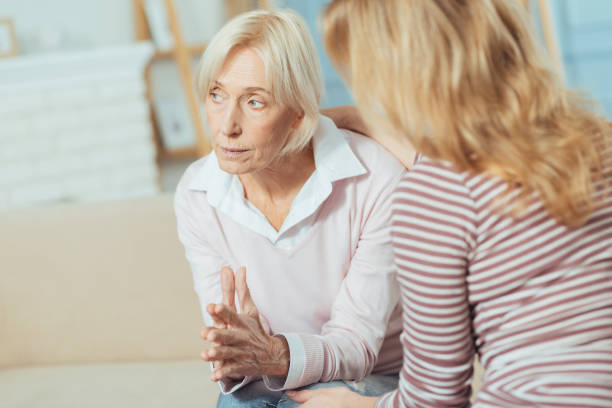 istock Aged woman looking into the distance while thinking about her treatment 889658082