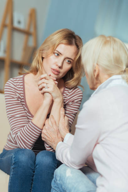 istock Upset young woman looking at the granny while having a serious talk 889658276