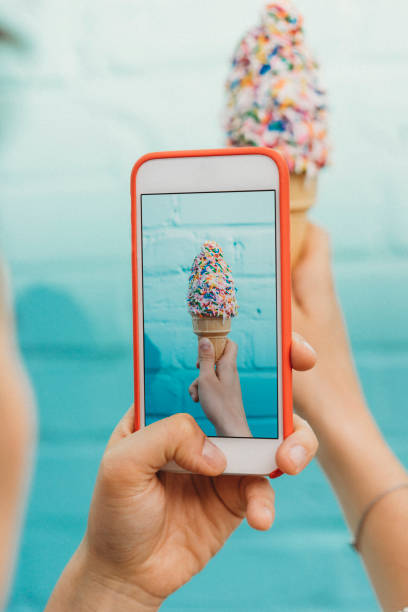 Photographing ice cream against blue wall