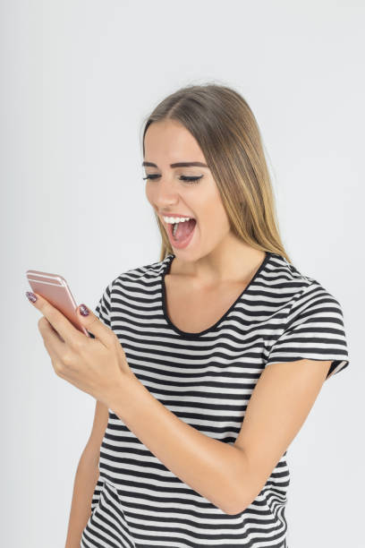istock Woman screaming on cellphone 889679374