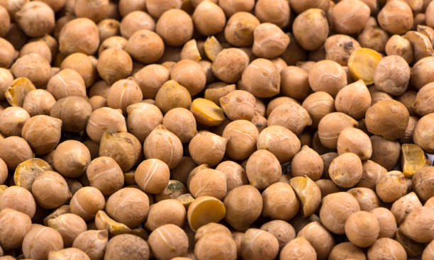 istock chickpea seeds background food grain light brown texture 889692256