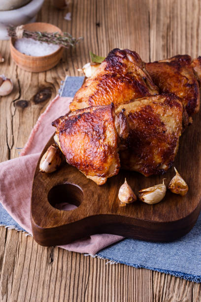 istock Roast chicken thighs with garlic 889700302