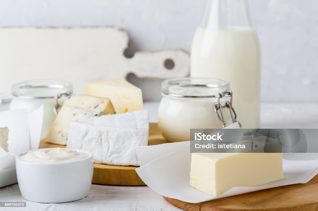 Fresh organic dairy products Fresh organic dairy products on white table Cheese Stock Photo