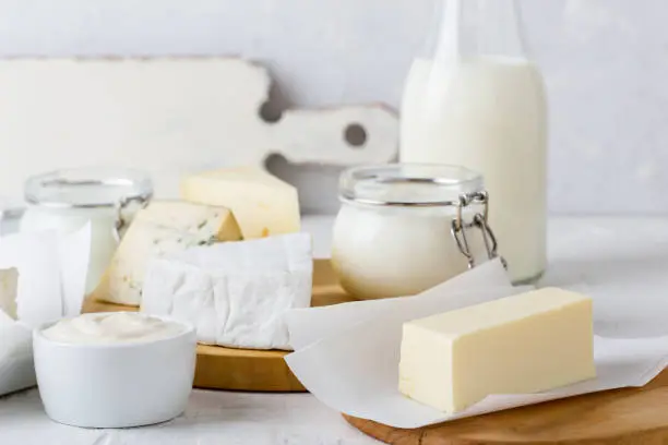 Fresh organic dairy products on white table