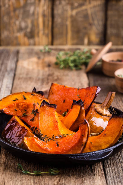 istock Baked pumpkin with thyme in cast iron skillet 889702556