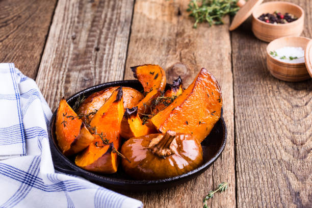 istock Baked pumpkin with thyme in cast iron skillet 889702638