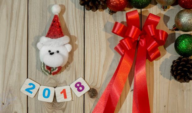 istock 2018 and Christmas decorations on a wooden background 889711960