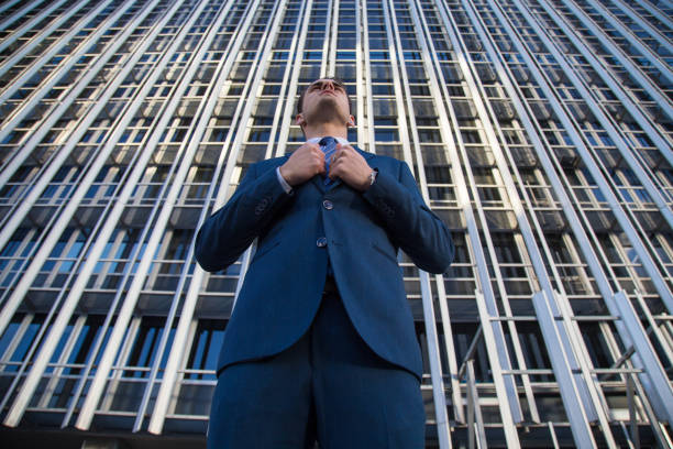 istock Confident businessman on urban background 889712310