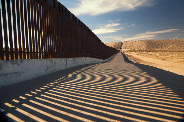 U.S. Border Wall Fence Fence separating United States and Mexico geographical border photos stock pictures, royalty-free photos & images