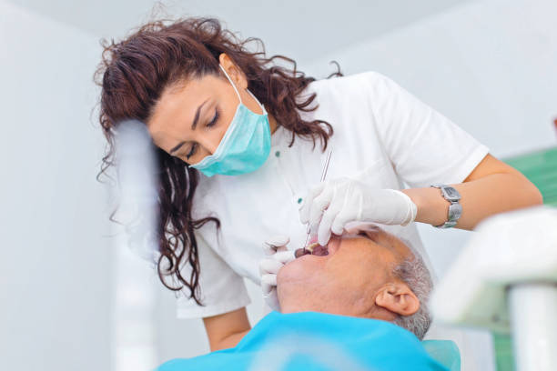 istock Senior man at dental checkup 889720388