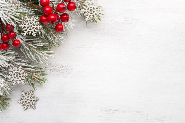 Fir branch with Christmas decorations on old wooden shabby background with copy space for text
