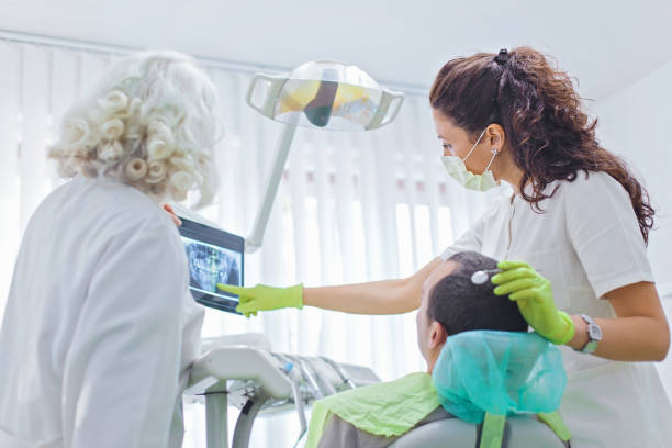 istock Young man at dental checkup 889730766
