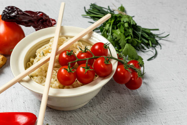 Noodles with vegetables. Typical oriental food
