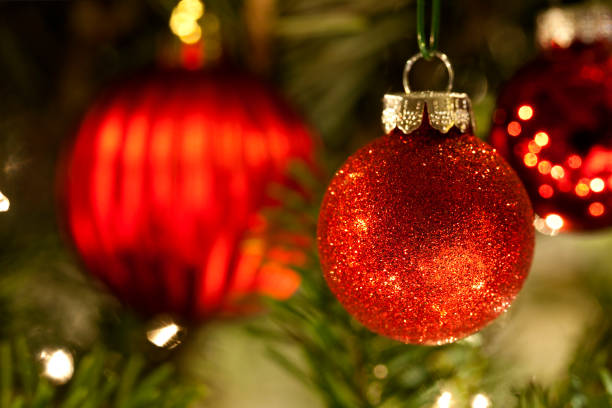 istock Red sparkling Christmas ornament on the holiday Christmas tree. 889746376
