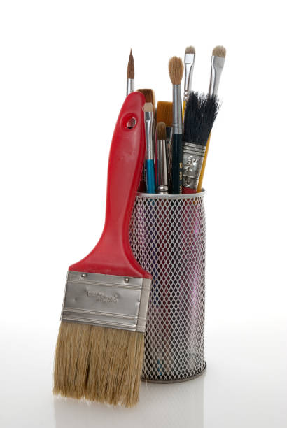 istock Paintbrushes in a metal mesh holder 889748660