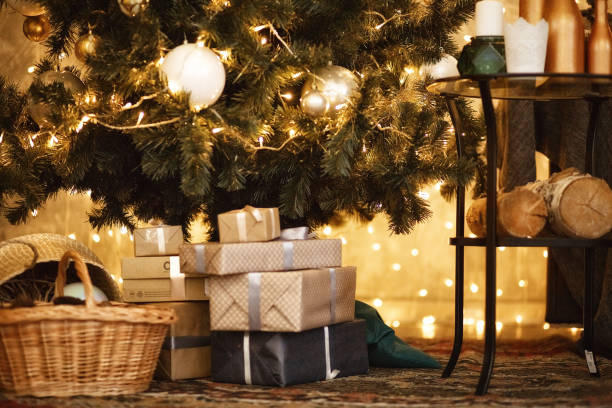 istock Gifts under the Christmas tree lights background 2018 889749112