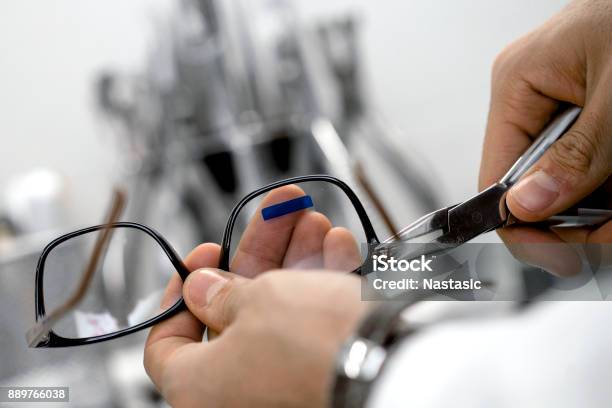 Optician Repairing Eye Glasses Stock Photo - Download Image Now - Eyeglasses, Repairing, Optometrist