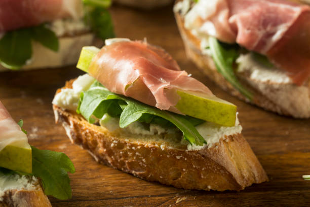 istock Homemade Prosciutto Pear Cheese Crostini 889774688
