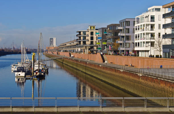 Waterfront view of the Europa harbor in Bremen, Germany with moored sailing yachts and modern office and luxury apartment buildings stock photo