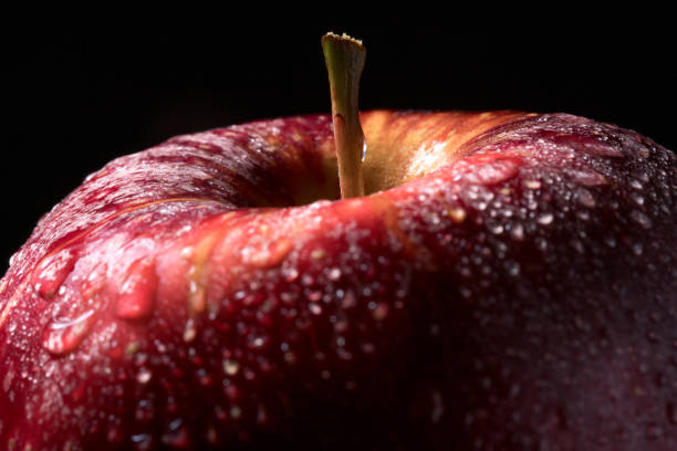 istock Juicy red apple with water droplets 889777872