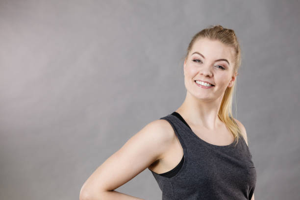 istock Happy woman wearing black tank top 889783256