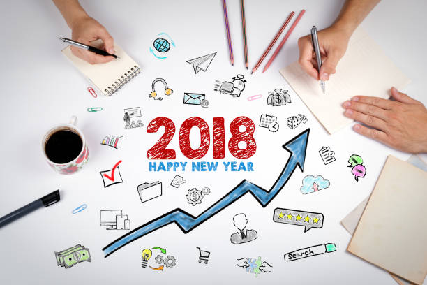istock 2018 Happy new year. The meeting at the white office table 889783348