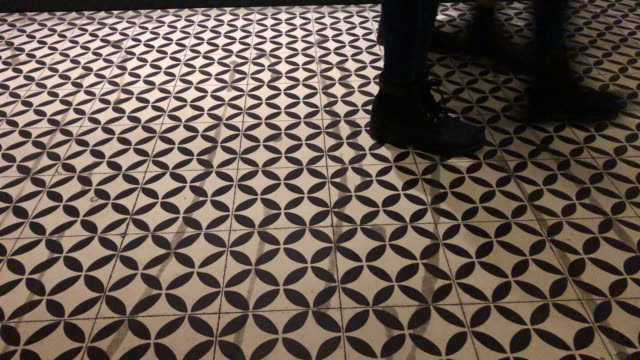 Feet on mosaic