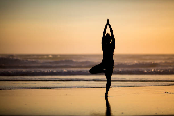 istock Woman doing meditation at sunset 889811598