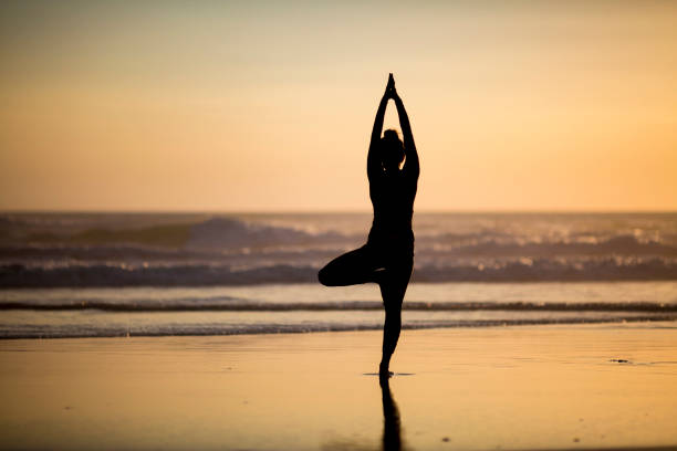 istock Woman doing meditation at sunset 889811698