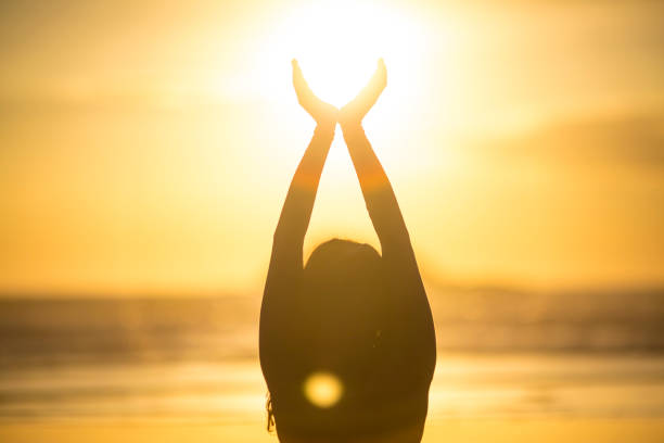 istock Woman doing meditation at sunset 889811926