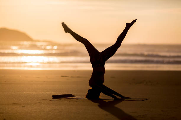 istock Woman doing meditation at sunset 889812094
