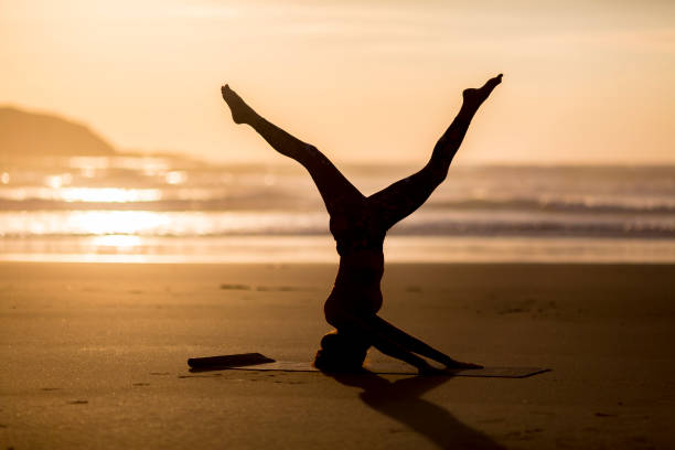 istock Woman doing meditation at sunset 889812122